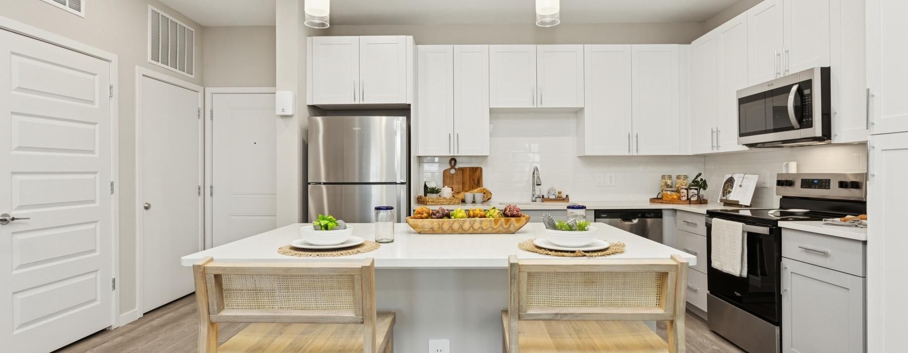 a kitchen with white cabinets