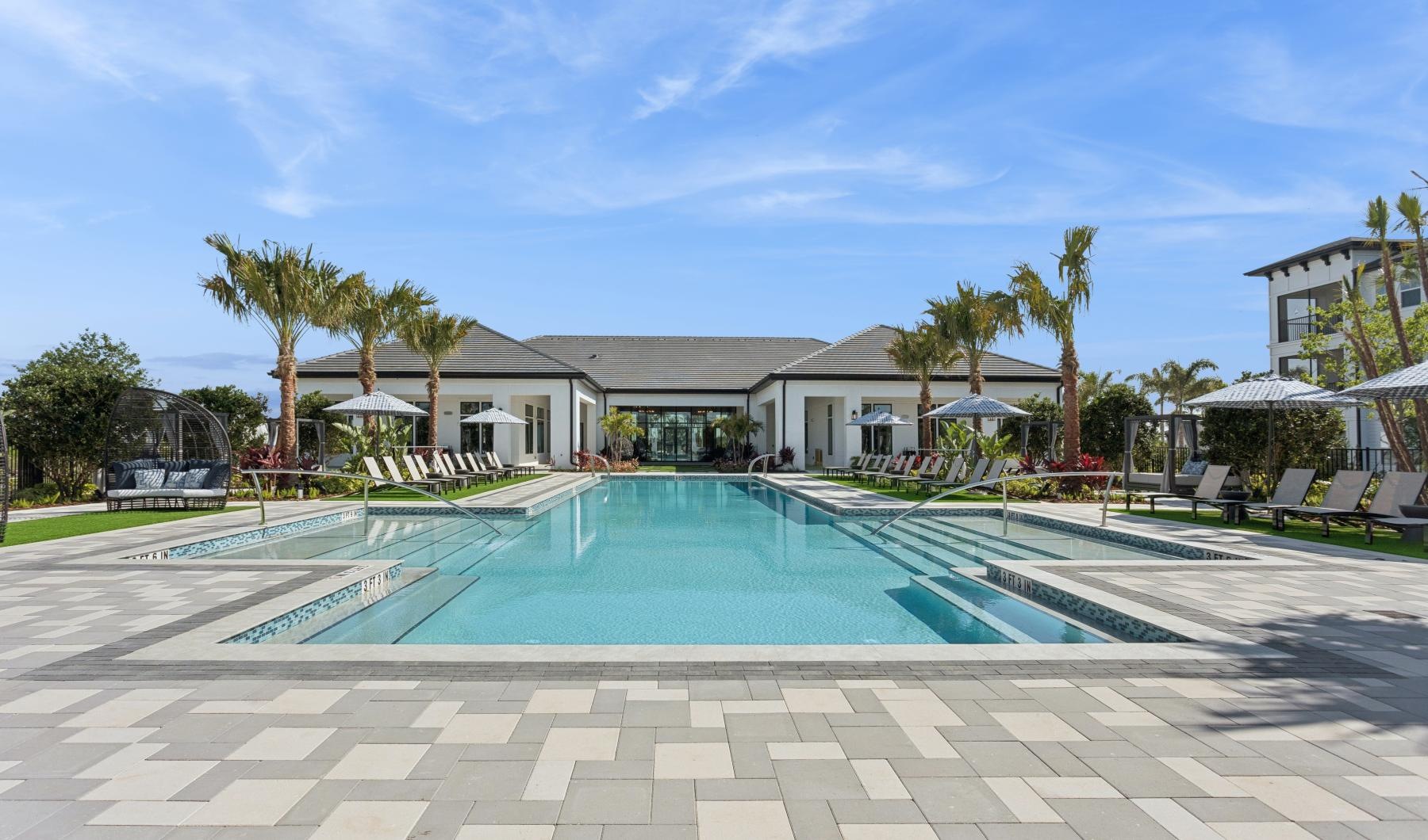 a swimming pool in front of a house