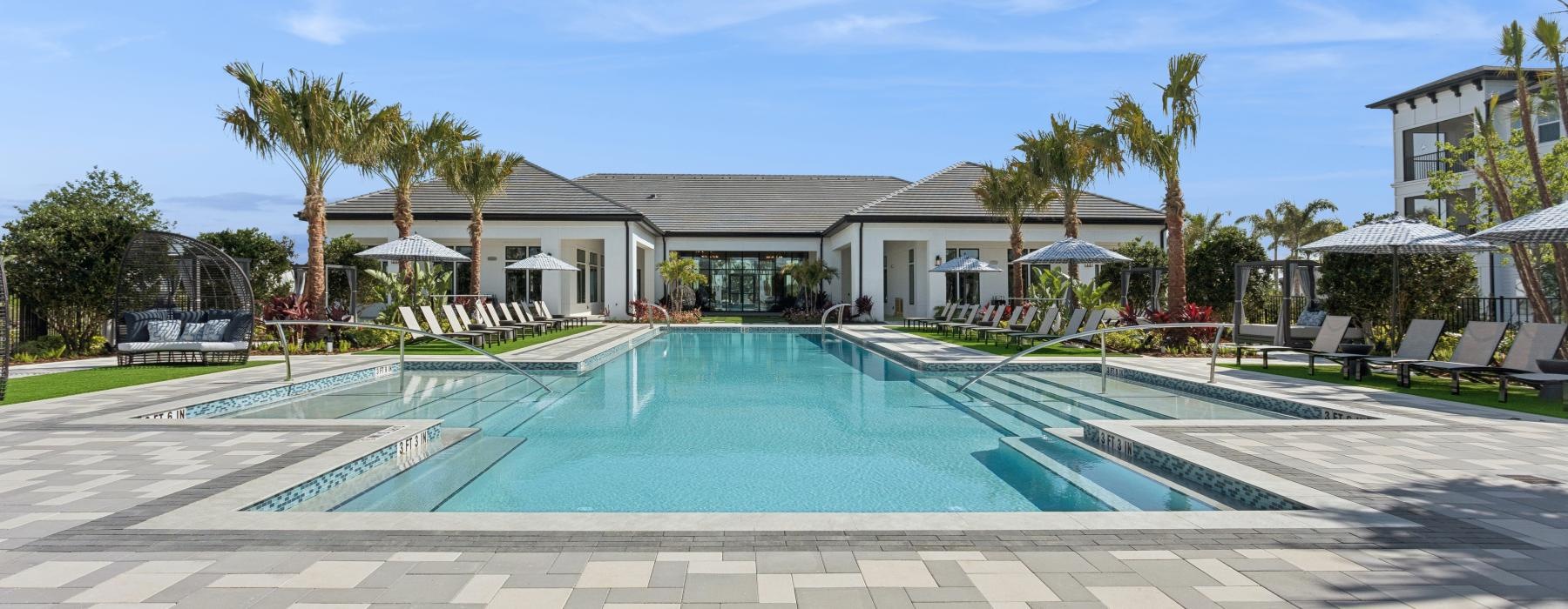 a swimming pool in front of a house