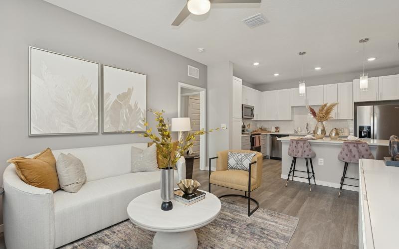a living room with a white couch and a table